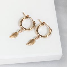 These gorgeous earrings are high quality 14kt gold filled.Adorned with 14kt god filled little leaves.Hoops measure 12mmWater Friendly Hypoallergenic Small Hoop Earrings In 14k Gold Filled, Rose Gold 14k Gold Filled Huggie Earrings, Gold 14k Drop Cartilage Earrings, Gold Drop Cartilage Earrings, Rose Gold Plated Drop Earrings, Nickel-free Small Hoop Earrings In 14k Gold Filled, Dainty Gold Plated Nickel Free Huggie Earrings, Rose Gold Plated Huggie Earrings, Rose Gold Small Hoop Earrings In 14k Gold Filled