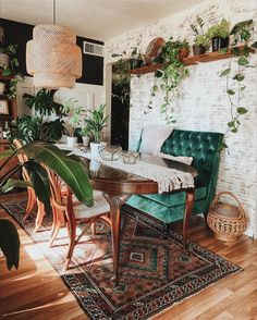 a living room filled with furniture and plants