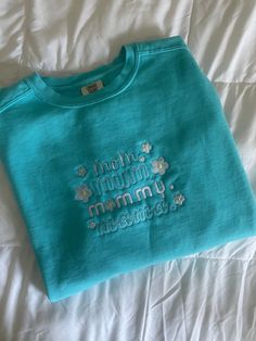 Looking for the perfect Mother's Day gift for the special mama in your life? Look no further than our Mom Embroidered Sweatshirt! Crafted with comfort and style in mind, this cozy and oversized sweatshirt is ideal for those chilly, laid-back days when you just want to relax. Featuring a beautiful aqua color and made with comfort colors sweatshirt material, this embroidered mama/ mom/ mommy sweatshirt is perfect to match any casual outfit. The high-quality embroidery adds a touch of elegance while remaining subtle enough to wear every day. With its relaxed fit and comfortable design, Mom Embroidered Sweatshirt guarantees ultimate coziness without compromising on style. It's an ideal Mother's Day gift that any mom would appreciate! Whether she's lounging at home or running errands around tow Cozy Cotton Sweatshirt With Embroidered Text, Casual Sweatshirt With Custom Embroidery For Mother's Day, Mother's Day Embroidered Cotton Sweatshirt, Casual Tops With Embroidered Text For Mother's Day, Casual Top With Embroidered Text For Mother's Day, Cotton Tops With Letter Embroidery For Mother's Day, Casual Sweatshirt With Embroidered Text For Mother's Day, Casual Mother's Day Sweatshirt With Embroidered Text, Mother's Day Casual Sweatshirt With Embroidered Text