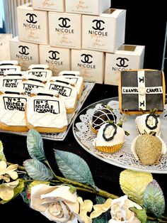 cupcakes and cookies are on display at a chandelier party