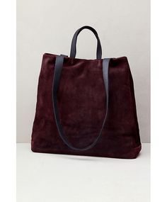 Luxury meets utility in the sophisticated Sutton tote, crafted from genuine water-resistant Italian suede leather. Featuring a roomy main compartment that can hold a 13-15" laptop, this rich calfskin suede bag also has a smaller zip compartment and open pocket inside. Carry it with the leather handles or by the shoulder straps—either way, the Sutton takes you where you need to go with all your essentials in tow. With magnetic snap closure, snaps along throat sides, and cotton lining throughout. Modern Suede Shoulder Bag For Travel, Suede Bag With Leather Lining For Work, Chic Suede Business Bag, Modern Suede Tote Bag, Suede Double Handle Work Bag, Modern Suede Bag For Daily Use, Suede Double Handle Bag For Work, Double Handle Suede Work Bag, Modern Suede Shopping Bag