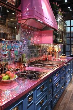 a kitchen with blue cabinets and pink counter tops is seen in this image from the inside