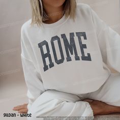 Rome Sweatshirt | Rome Crewneck | Rome Italy Sweatshirt | Trendy Sweatshirt | Vintage Sweatshirt | Oversized Sweatshirt This sweatshirt can be customized with any city, state, or country. Please message the seller for custom requests (no additional charge). Our sweatshirts are made of cotton and polyester making it soft, yet, durable.  Fiber content may vary with colors.  Because all of our sweatshirts are made to order, we do not accept returns or exchanges once the order has been placed.  Howe Oversized T-shirt With Ribbed Cuffs For College, Oversized White T-shirt With Lettering, White Oversized Varsity Sweatshirt, Oversized White Varsity Sweatshirt, Oversized White Sweatshirt With Text Print, White Oversized Sweatshirt With Text Print, Collegiate White Sweatshirt For Loungewear, Drop Shoulder Letter Print Tops For Loungewear, Loungewear Letter Print Drop Shoulder Tops