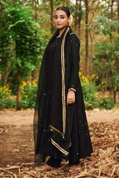 Black anarkali featuring scattered mirror work all over with kasap, pearl, pita, thread embroidery on the neckline and sleeve hem. Paired with a pant and a gota lace, tassel detailed dupatta. - Aza Fashions Black Lehenga With Gota Work For Diwali, Diwali Black Lehenga With Gota Work, Black Chanderi Anarkali Dupatta, Black Anarkali Set With Gota Work For Party, Black Mirror Work Dupatta In Traditional Drape, Party Anarkali Set With Gota Work In Black, Bollywood Black Lehenga With Gota Work, Black Sharara With Sheer Dupatta For Festive Occasions, Party Black Anarkali Set With Gota Work