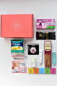 the contents of a pink box are laid out