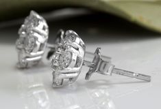 Exquisite 1.60 Carats Natural VVS Diamond 14K Solid White Gold Stud Earrings Amazing looking piece! Suggested Replacement Value $5,800.00 Total Natural Round Cut Diamonds Weight: 1.60 Carats (both earrings) VS1-VS2 / G-H Diameter of the Earring is: 9mm Total Earrings Weight is: 2.1 grams Disclaimer: all weights, measurements and colors are approximate and may vary slightly from the listed dimensions or as seen in the image. All pictures are magnified to show the smallest of details. Please, refe Luxury Cluster Earrings For Anniversary, Luxury Round Cut Cluster Earrings For Anniversary, Luxury Cluster Earrings With Prong Setting For Anniversary, Luxury Cluster Earrings With Vvs Clarity For Anniversary, Luxury Vvs Clarity Cluster Earrings For Anniversary, Luxury Brilliant Cut Cluster Earrings For Anniversary, Luxury Diamond Cut Cluster Earrings For Anniversary, Luxury Diamond Accented Cluster Earrings For Anniversary, Gia Certified Cluster Earrings For Formal Occasions