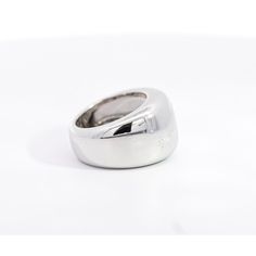 Vintage Cartier Nouvelle Vague Ring, set in 18K White Gold.   This unisex dome ring showcases a remarkable display of gleaming silver/white hues. An authentic vintage creation from Cartier, it embodies the brand's rich legacy of quality and craftsmanship. Made in 1997.  Item Details: - Type: Vintage  - Cartier Nouvelle Ring  - Serial No.: H16257** - Date: 1997 - Metal: 18K White Gold  - Weight: 14.3 Grams  - Size: 5  - Measurements: 13.5 MM   _______________________________  Please refer to the Timeless White Gold Dome Ring In Sterling Silver, Timeless White Gold Sterling Silver Dome Ring, Classic White Gold Wide Band Jewelry, Elegant Sterling Silver Dome Ring With Polished Finish, Modernist White Gold Signet Ring For Formal Occasions, Timeless White Gold Thick Band Ring, Elegant Concave Dome Ring For Wedding, Elegant Wedding Dome Ring With Concave Design, Classic White Gold Thick Band Ring