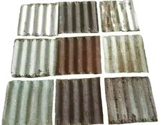 six different types of metal roofing tiles in various colors and sizes, all lined up together