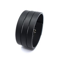 Simple minimalist narrow and chick men leather cuff of thick calfskin leather (approx. 3 mm thickness) in deep black color with soft gloss effect. One screw leather stud used as clasp. Not very wide but looks as many bracelets on a wrist.  Our other bracelets here https://etsy.com/shop/PrideAndBright ★ SPECIFICATIONS ★  - Handmade product  - Natural calfskin belt leather  - Color: black color  - Size: Best suited for wrist size from 6.7in/16cm till 7.5in/19cm  - Screw button stud Modern Cuff Bracelet With Black Band, Everyday Black Leather Cuff Bracelet, Modern Leather Cuff Bracelets, Modern Black Leather Cuff Bracelet, Modern Leather Strap Cuff Bracelets, Adjustable Modern Leather Bracelet, Modern Leather Wristband With Black Band, Modern Leather Strap Cuff Bracelet, Modern Black Leather Wristband