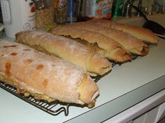 bread sticks sitting on top of a cooling rack