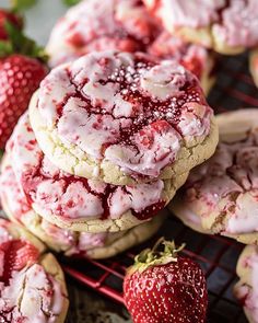 strawberry shortbread cookies with powdered sugar and fresh strawberries on the cooling rack