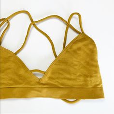 Strappy Back Bralette. Stretchy. Sizes Available: 1 Xs/S, 3 M/L In Bronze Gold Yellow New With Tags Length Before Stretch: Xs/S- 8.5" M/L- 9.5" Pit To Pit Before Stretch: Xs/S- 12" M/L- 13" 92% Nylon, 8% Spandex Boutique Spring Summer Fall Birthday Party Celebration Travel Vacation Weekend Casual Anniversary Dance Club Dinner Date Night Work School City Fashion Yellow Seamless Swimwear For Spring, Summer Yellow Bra With Comfort Fit, Summer Strappy Bra, Seamless Strappy Back Bra For Summer, Seamless Bra With Strappy Back For Summer, Summer Seamless Bra With Strappy Back, Fitted Yellow Bra For Summer, Stretch Yellow Triangle Top Intimate, Summer Yellow Bra