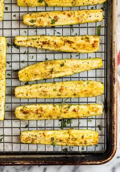 baked zucchini sticks on a baking sheet