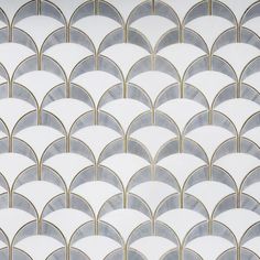 an art deco wallpaper with white and gold arches in the shape of fan shapes