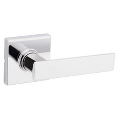 an image of a chrome door handle on a white wall mounted toilet paper roll dispenser