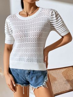 Get a perfor-mazing look with this Delphina knit top! A creamy delight boasting a perforated design, it'll be your go-to for any occasion and will make you look totally bella! Suitable for any stylish wardrobe, this top won't let you down. Size Guide: Influencer is 5’5” tall, and has a 33.4” bust, 24.7”waist, & 36.9” hips. She is wearing a S / US 4 / AU 8. This top is true to size. Material: 50% Viscose, 30% Polyester, 20% Acrylic. Key Features: Short sleeves. Crew Neckline. Soft Knit Fabricatio Spring Knit Hollow Out Sweater, Hollow Out Knit Sweater For Spring, Spring Hollow Out Knit Sweater, Spring Crew Neck Sweater With Hollow Out Design, Spring Hollow Out Crew Neck Sweater, White Stretch Top With Hollow Out Details, Casual Crew Neck Open Knit Mesh Top, Trendy Hollow Out Crew Neck Top, Spring Crew Neck Open Knit Top