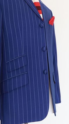 "pinstripe suit| 60s mod clothing white stripe in royal blue 2 piece suit for men Brand: Modshopping Style: Single breasted suit Main Colour: white stripe in royal blue Material: 50% wool and 50% mohair Material feeling: standard suiting Number of Pieces: 2 Lapel: Notch lapel Pattern: Stripe Button: 3 buttons Jacket Vents: double vent Inside lining: Paisley navy blue color lining Garment Care: Dry clean only Jacket: Modshopping A 2 piece suit for the gents, 3 buttons jacket, 1/1 jacket's front h Spring Pinstripe Suits For Office, Spring Pinstripe Office Suits, Spring Office Pinstripe Suits, Spring Pinstripe Suits, Spring Semi-formal Pinstripe Suits, Spring Fitted Pinstripe Suits, Spring Pinstripe Fitted Suit, 2 Piece Suit For Men, 60s Suit