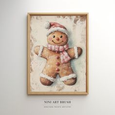 a painting of a gingerbread man wearing a santa hat and scarf on a white wall