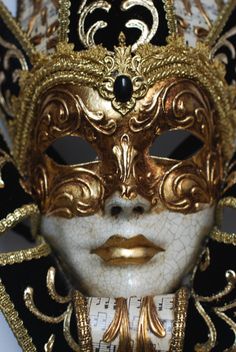 Hand-made papier-mâché mask made with the Craquelè technique, painted with acrylics, and embellished by gold-leaf, fabric and stucco decorations. The mask is further enriched by a beautiful collar. Full face mask, suitable for wearing or as home decor elements. Size: One-size. This mask ties in the back with two soft matching ribbons. Dimensions: 35 cm x 55 cm Produced in Venice, Italy. More shapes available, both for men and women. We ship worldwide with GLS, DHL and Fedex, directly from Venice Gold Artistic Masks For Formal Occasions, Gold Masks For Carnival And Formal Events, Gold Masks For Formal Carnival Occasions, Gold Formal Masks For Carnival, Gold Venetian Masquerade Mask For Formal Occasions, Gold Masks And Prosthetics For Mardi Gras, Gold Artistic Masquerade Mask For Formal Occasions, Artistic Gold Masquerade Mask For Formal Occasions, Traditional Gold Masquerade Masks And Prosthetics