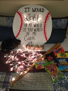 a baseball bat and some candy on a bed with a sign that says it would begin up my world if you would be my coach