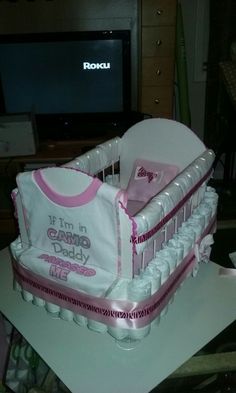 a baby's crib cake that is made to look like it was born