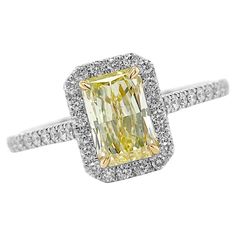 Crafted from Platinum the magnificent engagement ring comes enriched with 1.36 carats Cut-Cornered Rectangular Fancy Yellow Diamond Clarity SI1 GIA #6187262843 with Yellow Gold Settings and 50 Pave Diamonds 0.41 carats Split Shank. Size 6. Perfect High Jewelry Gift for Mom, Girlfriend, Daughter, Birthday or Christmas Gift. Gia Certified Emerald-cut Platinum Cluster Ring, Gia Certified Emerald Cut Platinum Cluster Ring, Yellow Diamond Platinum Ring With Center Stone, Gia Certified Classic Yellow Diamond Ring, Yellow Diamond Cut Platinum Ring, Dazzling Gia Certified Radiant Cut Diamond Ring, Yellow Platinum Diamond Ring With Diamond Cut, Gia Certified Emerald Cut Cluster Ring In White Gold, Gia Certified Radiant Cut Ring For Formal Occasions