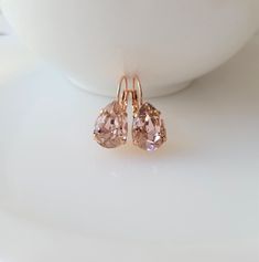 "~ELIANA ROSE GOLD COLLECTION~ A truly breathtaking set of earrings. Very elegant and versatile. Make a statement on your special day, or for a special night out. Perfect for your bridesmaids.... The feminine earrings feature rich 14mm \"Blush Vintage Rose\" teardrop crystals in a prong setting. The earwire is a lever back. Choose your finish setting color at checkout from gold plated, rose gold plated, or shiny silver plated from the dropdown menu. The earrings measure approx 1\" Earring Weight Blush Earrings, Pink Crystal Earrings, Feminine Earrings, Bridesmaids Earrings, Earrings Rose Gold, Tie Gifts, Earrings Crystal, Wedding Jewelry Earrings, Earrings Pink