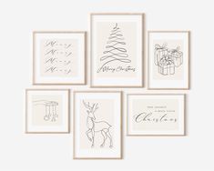 six framed christmas cards with handwritten holiday greetings in various shapes and sizes, hanging on a wall