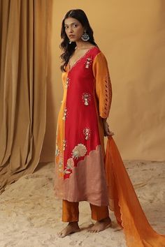 Orange chanderi silk cutwork kurta with floral hand paint and tasselled mirror work embroidery. Paired solid scallop edged dupatta and solid straight pant. - Aza Fashions V-neck Salwar Kameez With Chikankari Embroidery For Diwali, Diwali V-neck Salwar Kameez With Chikankari Embroidery, Chanderi V-neck Traditional Wear For Festivals, V-neck Chanderi Traditional Wear For Festivals, Festival Palazzo Set With Dupatta And V-neck, Festival Palazzo Set With V-neck And Dupatta, Festival V-neck Palazzo Set With Dupatta, Navratri Silk Churidar With Chikankari Embroidery, Unstitched V-neck Salwar Kameez With Dupatta