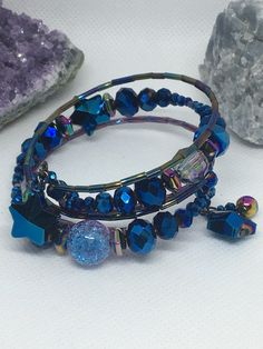 This unique wrap bracelet is part of my ⭐️STARSEED COLLECTION⭐️ of jewelry. YOU ARE A STAR! ☺️️ Made with themes of galaxy, the cosmos, stars, planets, outer space, Indigo children, Starseeds, and Lightworkers in mind, this bracelet set is absolutely one-of-a-kind. Each bracelet is made with quality glass and metal beads. The colors are blue, copper/rose gold, gold, silver, and rainbow iridescence. They are each so eye-catching and beautiful! Some beads are faceted. Some have an iridescence that Star-shaped Beaded Party Bracelets, Bohemian Star-shaped Beaded Bracelet, Adjustable Star-shaped Party Bracelets, Copper Rose Gold, Indigo Children, Copper Rose, Memory Wire Bracelets, Metal Beads, Gold Gold