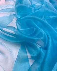 Azure Organza Fabric 60" Wide by the Yard. Teal Blue organza for Gowns,  Wedding, Party Decor, Draping and Crafts.  This sheer and soft organza fabric is a versatile choice for numerous creative projects from elegant garments to festive decorations. This aqua blue sheer Organza is ideal for creating everything from  wedding gowns, evening dresses, costumes, prom attire and bridal sets  to event backdrops. Infused with glitter, this fabric is perfect for event decor. Its sheer elegance brings a s Festival Skirts, Organza Fabric, Fabric Bolts, Vintage Maxi Dress, Bridal Outfits, Color Crystal, Sheer Fabrics, Soft Light