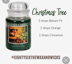 a candle with the words christmas tree on it