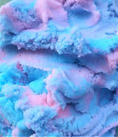 the blue and pink food is ready to be eaten