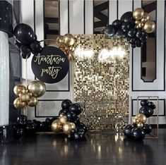 a black and gold party with balloons