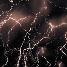 a black and white photo of lightning in the sky