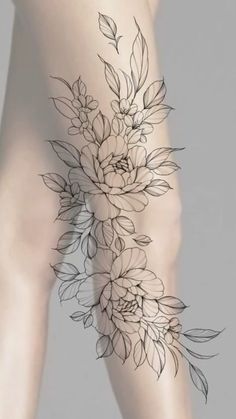 a woman's thigh with flowers on it