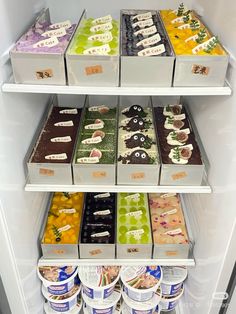 an open refrigerator filled with lots of ice cream