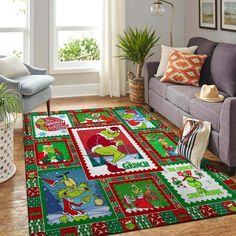 a living room area with a couch, chair and christmas decorations on the rugs