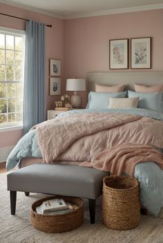 a bedroom with pink walls and blue bedding