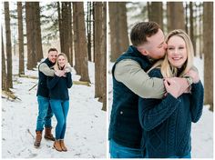 a man and woman hugging in the snow with trees behind them during their winter engagement session