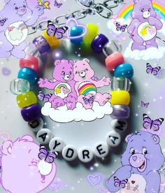 there is a bracelet with teddy bears and rainbows on the beads that say i love you