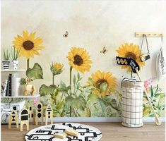 the sunflowers are painted on the wall in this child's playroom