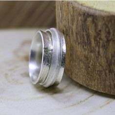 "Sterling silver statement ring for women. Spinner boho ring. Modern personalized wide band wedding ring. Every woman needs a gorgeous original jewelry piece that she'll treasure forever. This stunning spinner ring is one of my most popular items. It will keep your look chic & modern. The ring is super durable and is suited for everyday use. It can be engraved inside with words for your choice what makes is an ideal wedding ring. The ring will look amazing with both casual everyday wear and Wide Band Wedding Ring, Ring Silver Wedding, Silver Wedding Band, Sterling Silver Jewelry Rings, Wide Band Ring, Personalized Ring, Silver Wedding Bands, Jewelry Wedding Rings, Statement Ring Silver