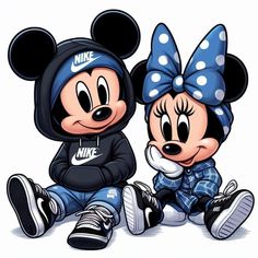 two mickey and minnie mouses sitting next to each other with their heads covered in polka dots