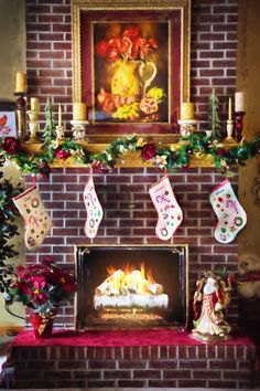 a fireplace with stockings hanging from the mantle