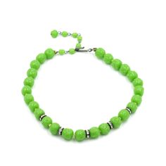 "Bright green dimpled glass bead necklace with rhinestone spacers. The metal on this piece has some significant corrosion which is reflected in the price. Still a nice mid-century statement ready to live its second life. Unmarked/unsigned. Length adjusts from 13\" to 15.5\" Long Weighs: 52.5 grams Please feel free to contact me with questions and/or for additional photos. More glass statements in the shop: Light blue melon bead necklace - www.etsy.com/BaseFare/listing/1486001901 Mixed glass bead necklace - https://etsy.me/3KBl2AK *Free Domestic Shipping on Orders Over $35* All orders ship USPS Ground Advantage. If you would like to add insurance please reach out before purchase. All of our items are in good, vintage condition; because of their past lives expect some minor surface abrasions Green Glass Round Bead Jewelry, Green Glass Jewelry With Faceted Beads, Green Crystal Necklaces With Faceted Beads, Elegant Green Crystal Necklaces With Faceted Beads, Green Faceted Glass Beads, Green Single Strand Czech Glass Necklace, Green Glass Round Bead Necklaces, Green Single Strand Necklace Made Of Czech Glass, Single Strand Green Czech Glass Beads