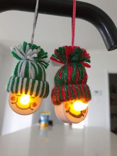 two christmas lights hanging from a ceiling