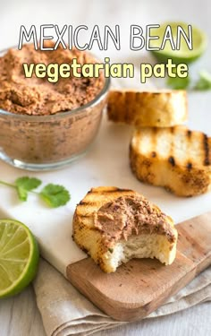 mexican bean and vegetable pate on a cutting board with limes next to it