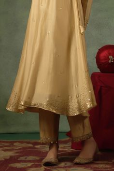 Gold kurta with zardozi, sequin embroidery on neckline, sleeves and buttis spread all over in leaf butta pattern. Paired with border embroidered pant and dupatta. - Aza Fashions Elegant Traditional Wear With Gota Work For Reception, Elegant Festive Palazzo Set With Gota Work, Gold Palazzo Set In Raw Silk With Mirror Work, Gold Palazzo Set With Mirror Work In Raw Silk, Elegant Salwar Kameez With Gota Work And Traditional Drape, Traditional Gota Work Palazzo Set For Reception, Elegant Salwar Kameez With Gota Work, Gold Unstitched Suit With Mirror Work And Traditional Drape, Unstitched Suit With Mirror Work For Reception