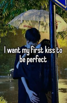 two people hugging under an umbrella in the rain with text that reads, i want my first kiss to be perfect